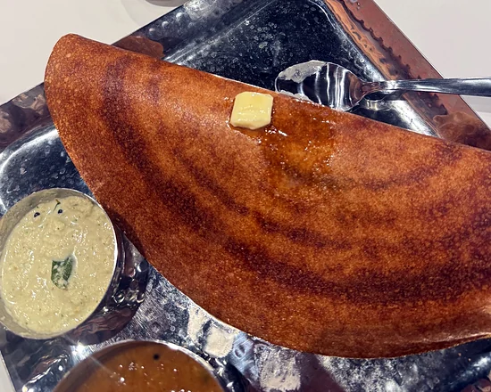 Bangalore-style dosa with a pat of butter, chutney and sambar